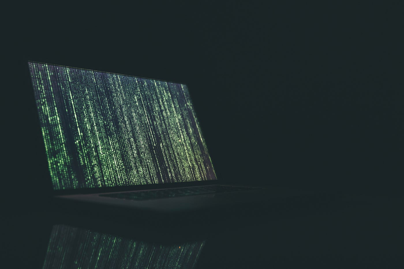 A photo of code on a computer screen in a dark space